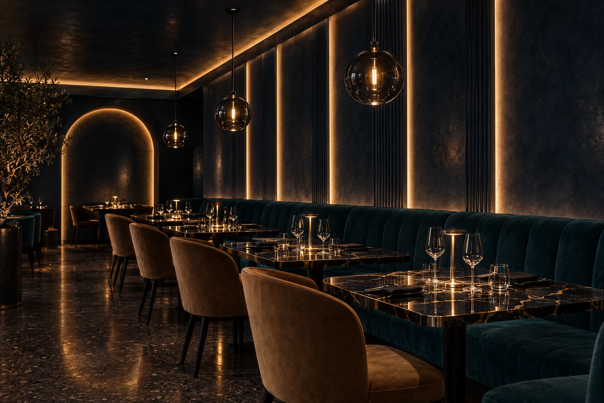 Concept moody restaurant with midnight blue Venetian plaster, glowing light reveals, a cove-lit arch, teal mohair banquettes, camel suede chairs and Nero Portoro marble tables